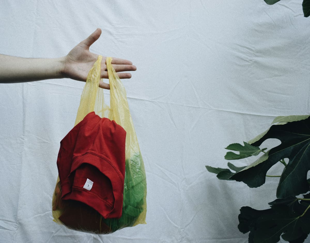 Handing over a bag of clothes for a swap
